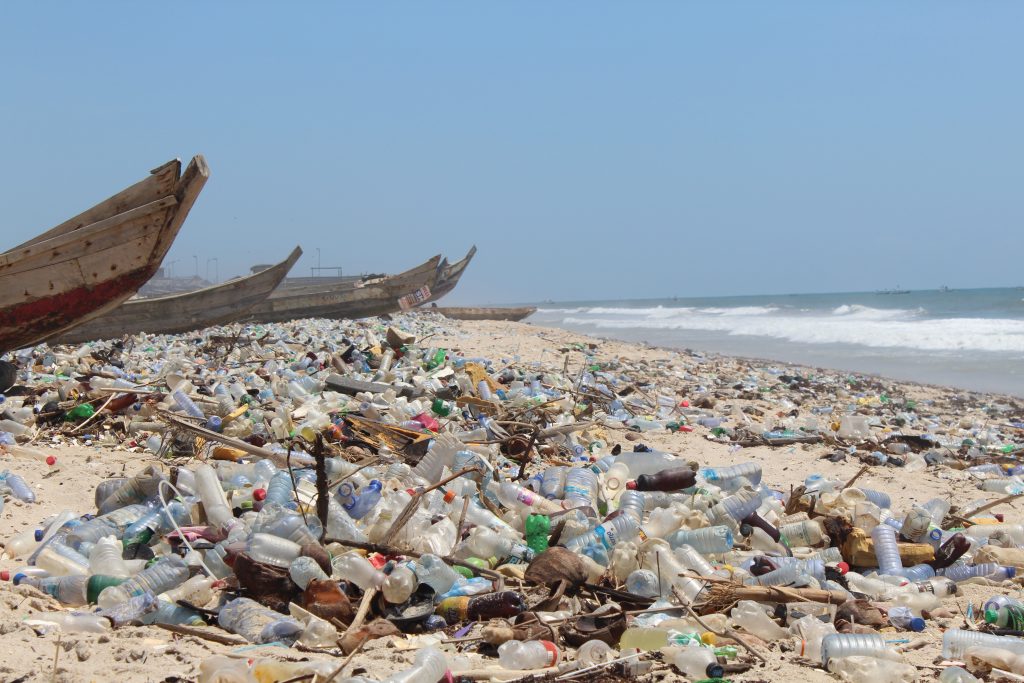 Beach In Ghana affected by plastic polluition, as entire coatel line is filled with plastic and rubbish 